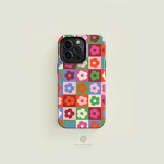 an iphone case with colorful flowers on the front and back cover in red, pink, blue, green, yellow