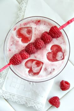 raspberries and ice cream in a glass with strawberries