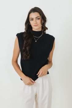 Stay stylish and comfortable all season long in the Mock Neck Sweater Vest for Women in Black! Featuring a mock neck and soft material at the touch, you need to add this to your cart for Fall! Features: Mimosa Style: MT1546-BLACK Color: Black 42% Acrylic 30% Polyester 28% Nylon Women’s Sweater Vest Sleeveless Mock neck Ribbed soft sweater vest material Measurements from a size small: Length from center back: 22” Chest: 36" hand cold wash, lay flat to dry Soft Knit Funnel Neck Tops For Work, Mock Neck Top For Work, Black Mock Neck Top For Fall Layering, Stretch Turtleneck Sweater Vest For Work, Black Mock Neck Top For Winter Layering, Trendy Black Turtleneck For Work, Trendy Black Mock Neck Top For Winter, Casual Black Turtleneck For Layering, Solid Turtleneck Sweater Vest For Winter