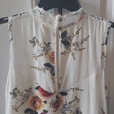 Blouse Is In Good New Condition Length Is 31" Feminine White Blouse With Floral Print, White Sleeveless Blouse With Lace Trim, White Floral Print Daytime Blouse, White Sleeveless Flowy Blouse, White Sleeveless Blouse For Brunch, White Flowy Top For Daywear, Flowy White Top For Daywear, White Flowy Top For Daytime, Flowy White Top For Daytime