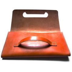 a brown leather case with a metal handle