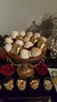 a table topped with lots of different types of desserts and candies on top of it