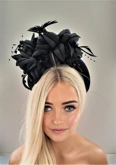 "Presenting a stunning beautiful black fascinator with feathers and beading, attached via a  satin covered headband  which is 4 cms in width at the widest part approximately and 3.5 cms in height (the headband) the feather flower design is much higher above the design. Perfect for special events.  If you would like the design customising at all, or an alternate colourway please get in touch with me and I will be delighted to help.   I do offer combined shipping on all my items, although this may Black High Crown Headpiece For Wedding, Adjustable Tall Crown Headband, Adjustable Crown-shaped Fascinator For Party, Structured Crown Headpiece For Royal Ascot, Black Round Crown Headpieces For Wedding, Elegant Black Headpiece With Tall Crown, Black Headband For Royal Ascot, Headband For Races, Summer Party Headpiece With Round Crown