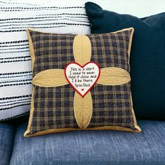 a decorative pillow with a cross on it