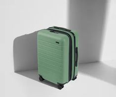 The Carry-On Flex | Away: Built for Modern Travel Functional Green Luggage For On-the-go, Functional Green Rectangular Luggage, Practical Green Luggage With Sleeve, Functional Portable Luggage For Overnight Trips, Functional Green Luggage For Trip, Functional Rectangular Luggage For Storage, Versatile Green Travel Accessories With Luggage Sleeve, Modern Green Travel Cases, Practical Green Luggage For Travel