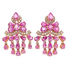 Sunita Nahata presents an exclusive collection of pink sapphire earrings. This particular earring showcases dangling sapphires and diamonds, and is constructed to fall elegantly on the wearer. Designer pink sapphire earring in 18K rose gold with diamonds. Pink Sapphire: 9.725 carat in various shapes and sizes. Diamonds: 0.78 carat, G colour, VS clarity. Gold: 11.496g, 18K rose gold. Sapphire Earring, Pink Sapphire Earrings, Pink Ruby, Aquamarine Earrings, Naha, Sapphire Earrings, Lovely Jewellery, Rose Gold Diamonds, Dream Jewelry