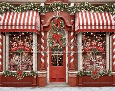 a red and white store front with christmas decorations