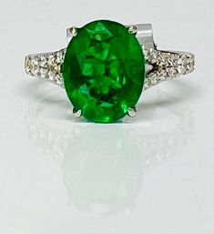 Vivid Oval Emerald and Diamond Ring – Seng Jewelers Oval Tsavorite White Gold Ring, Oval Tsavorite Ring In White Gold, Oval Tsavorite Ring With Center Stone, Luxury Oval Emerald Ring With Vs Clarity, Classic Oval Emerald Ring With Vs Clarity, Classic Oval Tsavorite Ring, Oval Emerald Ring With Vs Clarity For Formal Occasions, Formal Oval Emerald Ring With Vs Clarity, Oval Emerald Ring With Accent Stones In Platinum