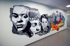 an office wall with several portraits of people on it and the words banneker above them