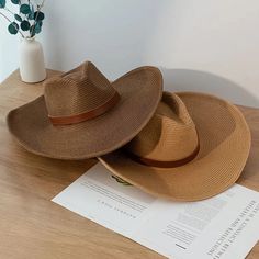 Discover the Perfect Blend of Style and Functionality Step out in style this summer with our New Design Natural Paper Western Cowboy Hat. Whether you're heading to the beach, a music festival, or just enjoying a sunny day outdoors, this hat is your ultimate accessory. Crafted with a blend of natural paper and polyester, it offers a lightweight and breathable fit, making it ideal for warm weather. Versatile and Unisex This cowboy hat is designed for both men and women, offering a unisex appeal that fits seamlessly into any wardrobe. Its solid pattern and casual style make it a versatile piece that complements any outfit, whether you're going for a laid-back beach look or a more polished summer ensemble. Key Features Material: Natural paper and polyester for a lightweight, breathable feel. B Adjustable Fedora For Travel And Beach Season, Adjustable Fedora For Beach Season Travel, Adjustable Flat Brim Bucket Hat For Summer, Fedora Panama Hat For Beach Season, Panama Fedora Hat For Beach Season, Summer Outdoor Hat With Short Brim, Summer Wide Brim Panama Hat For Outdoor, Summer Outdoor Wide Brim Panama Hat, Trendy Beach Season Travel Hat