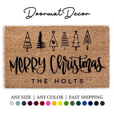 merry christmas door mat with pine trees on it