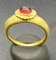 Ancient GREEK'S GOLD RING WITH GARNET STONE Signet Stamp. Beautiful Tree Leave Figure Is Engraved On Garnet Stamp Signet. Size And Details Pictures Are Listed Above. For Better View Of Stamp We Imprint The Stamp On Wax Clay As Shown In The Pictures. Gold Emerald Cabochon Ring For Formal Occasions, Gold Cabochon Domed Rings, Byzantine Gold Cabochon Jewelry, Byzantine Gold Jewelry With Cabochon, Gold Byzantine Jewelry With Cabochon, Oval Gold Ruby Ring For Ceremonial Occasions, Oval Yellow Gold Ruby Ring For Ceremonial Occasions, Oval Ruby Ring In Gold For Ceremonial Occasions, Gold Ruby Ring With Bezel Setting, Heirloom Style