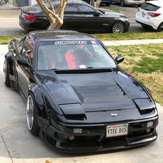 a black sports car parked on the street