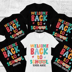 four t - shirts with the words welcome back to school written in multicolored letters