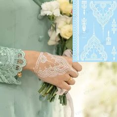 a woman with henna on her hand and flowers in front of her arm,