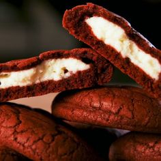 chocolate cookies with white cream filling on top