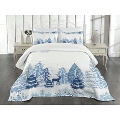 a white and blue bed with trees on it