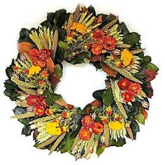 a wreath with flowers and leaves on it