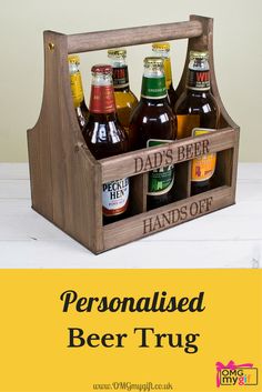 a wooden crate filled with beer bottles on top of a table