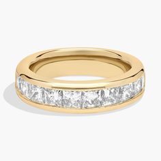 a yellow gold wedding band with princess cut diamonds