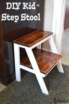 a wooden step stool sitting on top of a rug next to a cabinet and door