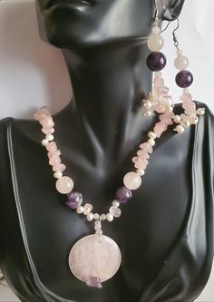 "Beautiful gemstone Amethyst and Rose Quartz that blend so well in colors of purple and pink. Amethyst has a cleansing energy and are known to instill feelings of understanding, calmness. Healing properties against negative energy. Rose Quartz is the stone of universal love. Purifies and opens the heart at all levels to promote self love, deep inner healing. Large Rose Quartz pendant measures 1.5' in diameter, 1/4' thickness, with Amethyst chip at the bottom of round pendant 2 large Amethyst pur Purple Rose Quartz Jewelry For Healing, Round Purple Rose Quartz Jewelry, Purple Rose Quartz Round Jewelry, Purple Rose Quartz Beads Jewelry, Purple Rose Quartz Round Beads Jewelry, Round Rose Quartz Jewelry For Meditation, Rose Quartz Jewelry For Meditation, Purple Rose Quartz Gemstone Jewelry, Pink Amethyst Spiritual Jewelry