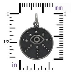 Handmade in Bali by expert silversmiths, this intricately detailed 15x1mm .925 sterling silver disc pendant depicts a wire-work eye partway toward the top, with eight graduated lines of granulated beads radiating outward from the eye. A narrow wire ring encircles the disc, and the background is darkly oxidized for contrast against the brightly polished rays and eye. Wearing an evil eye is traditionally meant for protection against the 'evil eye' which can bring bad luck and misfortune. While evi Travel Charms, Beading Tools, Wire Ring, Bad Luck, Feather Charms, Wire Rings, Disc Pendant, Ancient Coins, Wire Crafts