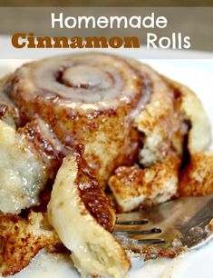 cinnamon roll on a plate with fork and text overlay that reads homemade cinnamon rolls