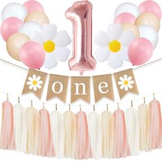 the first birthday banner is decorated with pink, white and gold balloons that spell out one