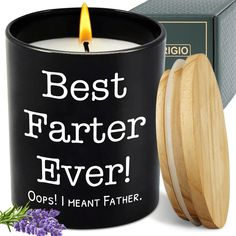 a candle with the words best farter ever on it next to a boxed box