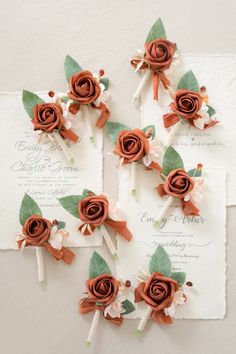 wedding flowers are arranged on top of an envelope