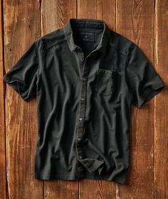 Collared Shirt With Placket For Casual Gatherings, Black Collared Top For Casual Gatherings, Collared Camp Shirt For Casual Gatherings, Casual Cotton Tops With Functional Buttons, Casual Polo Shirt Button-up For Business Casual, Fitted Casual Button-up Polo Shirt, Casual Polo Shirt With Relaxed Fit, Black Cotton Polo Shirt With Pockets, Cotton Button-up Polo Shirt With Pockets