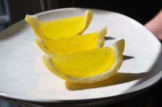 a white plate topped with slices of lemon