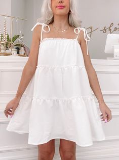 Our Maybelle is an adorable tiered ruffle white dress. She features self tie straps at the shoulders. Lined. fit: true to size - model wearing size small Ruffle White Dress, Sassy Shortcake, Adorable Dresses, Wedding Wardrobe, Babydoll Dresses, Easy Trendy Outfits, Feminine Dress, Dream Board, Cute Fits