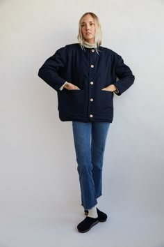 *FINAL SALE* DESCRIPTION: Reversible, plastic-free jacket made from 100% regenerative merino wool on one side and organic cotton twill on the other. Large patch pockets on both sides, top and side entry on the fleece side. Inspired by the functionality of military outerwear, vented armpits and a collar that buttons into the neckline when you need it and out when you don't. The heathered denim fleece is made with a mix of navy and natural fibers on a natural knit back, designed to mimic vintage d Navy Button-up Outerwear With Patch Pockets, Winter New England Outfits, Oversized Quilted Jacket For Workwear, Everyday Quilted Jacket With Pockets For Fall, Fall Dark Wash Outerwear For Work, Dark Wash Outerwear For Work And Fall Season, Dark Wash Outerwear For Fall Workwear, Everyday Winter Quilted Jacket With Pockets, Indigo Outerwear With Patch Pockets For Fall