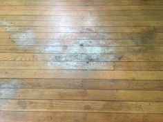 wood floor with white stains on it