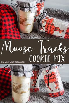 three mason jars with moose tracks on them and the words moose tracks cookie mix in front