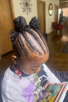 This fun cornrow hairstyle for kids has hair that is parted evenly and braided into rows from the forehead to the top of the head. At the top, the braids come together into two puffy bunches, making it more playful and puffy. With colorful beads on the ends, this style keeps the hair in place nicely but also adds some excitement, just - Click to see more of 20 Cute and Stylish Cornrow Hairstyles for Little Ones and follow us for more hairstyle ideas. // Photo Credit: Instagram @braidedxkam Hairstyle For Kids