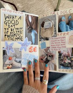 a woman's hand is holding an open book with pictures and words on it