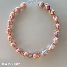 One picture corresponds to one product. 1 Strand 16 inch Flame Aurora Baroque pearl necklace Size: 13.8mm-16.2mm（W）     19.2mm-24.5mm（L） Pearl color: Natural Gold & Purple Rainbow，strong natural metallic. Holes: go though The luster and shape of this batch of flame baroque pearl necklaces are very pretty. I hope to provide high-quality services for your pearl jewelry design. Rose Gold Pearl Necklace With Round Beads, Unique Jewelry Necklace, Purple Rainbow, Pearl Jewelry Design, Edison Pearls, Baroque Pearl Necklace, White Gold Chains, Natural Gold, Pink Rainbow