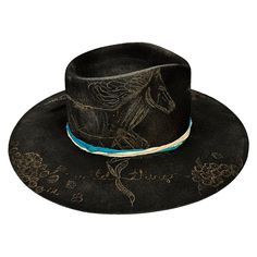 Rancher style cowboy hat for cowgirls custom burned by hand exclusively for Bourbon Cowgirl! We worked with this popular designer to create our very own look. 100% wool rancher hat in black which looks great with every outfit. One size fits all, as the interior band is adjustable to fit most. A beautiful rancher style with a pinch crease, this gorgeous black cowgirl hat is sanded and torched to a beautifully burnished and distressed finish. Firm shape (do not crush). Our artisan has hand burned Custom Black Fedora For Kentucky Derby, Handmade Black Hats For Country Events, Custom Black Hat Bands For Kentucky Derby, Custom Black Hat Bands For Ranch, Custom Felt Hat For Rodeo, Handmade Black Hat Bands For Country Events, Custom Handmade Black Felt Hat, Custom Black Felt Hat For Country Events, Western Black Hat Bands For Kentucky Derby