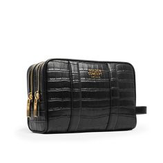 Modern travelers demand more than just a functional toiletry bag. They seek craftsmanship and functionality tailored for their brief journeys, meticulously designed to complement their luggage. Introducing our enhanced toiletry bag – a larger version equipped with double zippers for the ideal storage solution for all your travel products. Accentuated by refined Gold detailing, adorned with the GC-Logo and made in Croc Embossed Leather. SIZE25x18,5x10 cm Luxury Zipper Pouch Bag For Business, Luxury Zipper Pouch Shoulder Bag For Travel, Luxury Rectangular Pouch With Zipper Pocket, Luxury Business Bags With Zipper Pouch, Luxury Business Bag With Zipper Pouch, Luxury Travel Shoulder Bag With Zipper Pouch, Luxury Travel Bag With Zipper Pouch, Business Cosmetic Bag With Removable Pouch, Luxury Travel Pouch With Zipper Closure