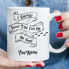 a woman holding a coffee mug with some writing on it