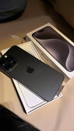 an iphone 11 is sitting in its box on top of the table next to it's packaging