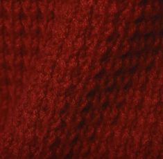 red yarn is shown in this close up photo