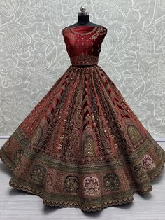 This stunning maroon color velvet bridal lehenga, exquisitely crafted to make you shine on your special day. The richness of the velvet material combined with intricate details such as multi-thread work, sequin work, diamond work, zari work, embroidered work, hand mirror work, and fancy dori work, ensures a masterpiece that epitomizes luxury and grace. The attention to detail in every stitch and embellishment speaks volumes about the craftsmanship that went into creating this ensemble.
Paired wi Festive Semi-stitched Heavy Lehenga, Heavy Red Dupatta With Traditional Drape, Red Heavy Lehenga For Festive Occasions, Festive Anarkali Heavy Lehenga, Red Embellished Lehenga For Festive Occasions, Traditional Heavy Red Dupatta, Heavy Red Lehenga For Reception, Red Embellished Bollywood Lehenga, Heavy Red Bollywood Lehenga