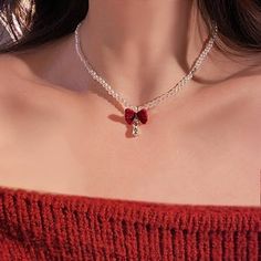 A dainty choker with a pearl bead, striking red bow, a teardrop tiny zircon dangling, sweet and festive feel - perfect for the holidays, parties, or dinners, and easy to match any look! ----------- DESCRIPTIONS ----------- - Materials: Faux Pearl, Velvet, CZ - Length: 43cm - SKU: E1688 Elegant Christmas Party Necklaces, Cute Red Necklace For Parties, Valentine's Day Party Bow Jewelry, Elegant Jewelry With Red Bow For Gifting, Elegant Red Jewelry With Bow, Valentine's Day Party Jewelry With Red Bow, Valentine's Day Jewelry With Red Bow, Bow Choker, Elegant Gothic