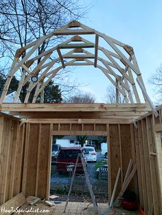 the inside of a house being built with wood framing and roof trussing on it