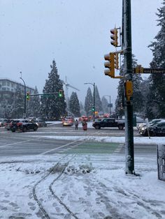 traffic lights and cars on a snowy street