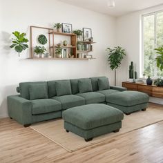 a living room filled with furniture and plants